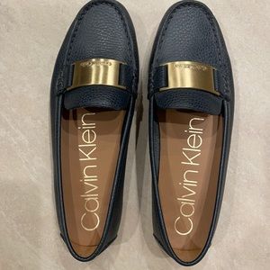 Calvin Klein loafer, blue w gold medallion. Size 7 / 7.5. Like new.
